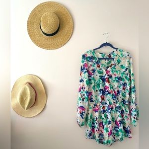 Floral romper. Woman’s size S/M. Fits like a 4-8. Adorable for the Spring!